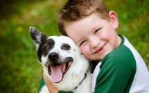 Child-lovingly-embraces-his-pet-dog